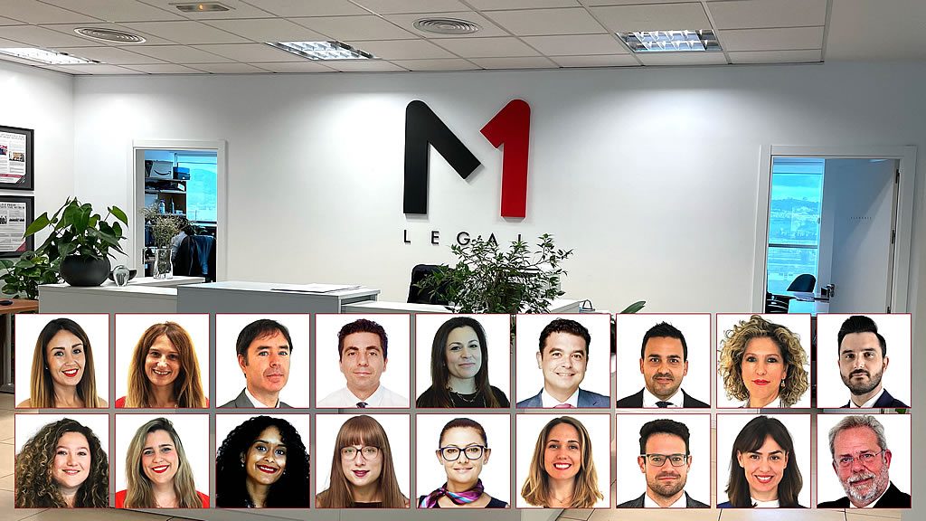 Reception area with large M1 Legal wall logo above a row of staff headshots, representing M1 Legal timeshare lawyers