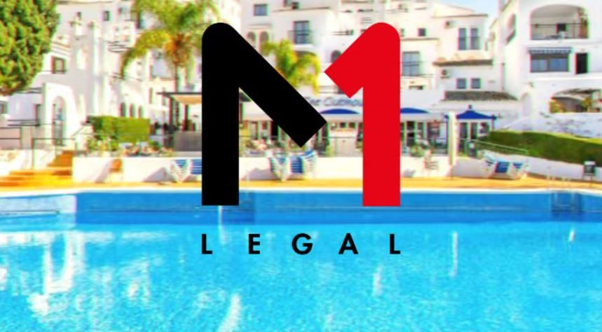 M1 Legal logo over a blurred image of a resort swimming pool and white apartment buildings in Spain