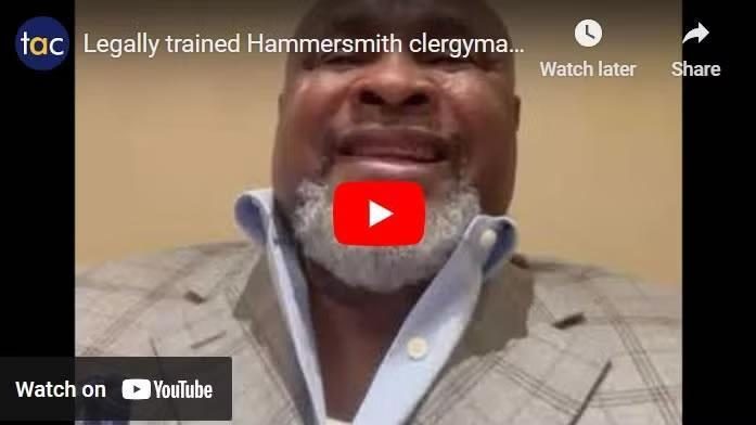 Close-up of a man in a checked blazer and open-collar shirt on a YouTube video thumbnail, with a red play button overlay and TAC icon in the corner