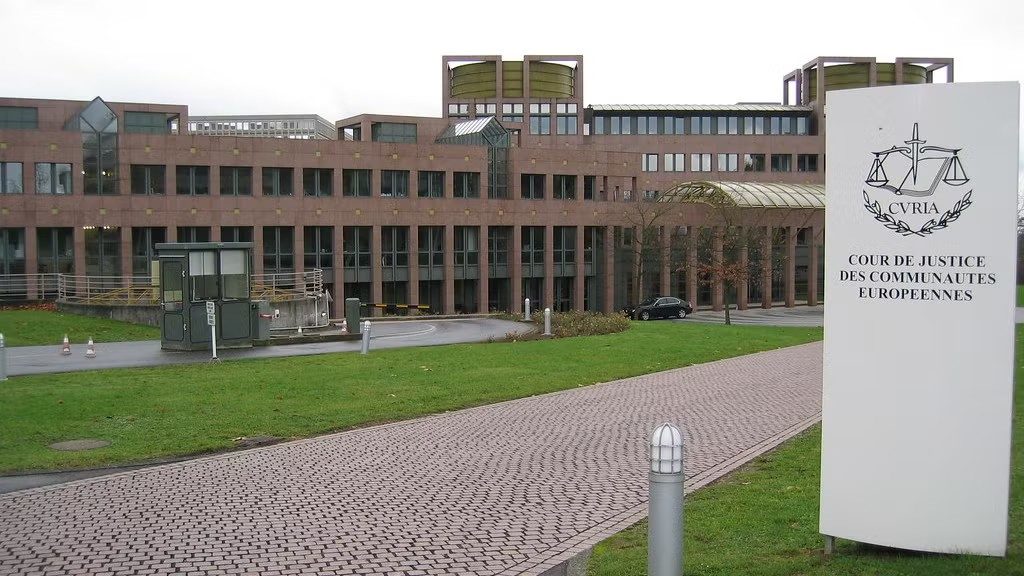 Sign outside the European Court of Justice building reading “CVRIA” and “Cour de Justice des Communautés Européennes” in Luxembourg