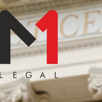 M1 Legal logo over a blurred courthouse facade with stone columns and the word JUSTICE in the background