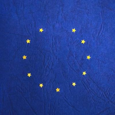 European Union flag with yellow stars on a blue background, used to illustrate cross border mediation after Brexit