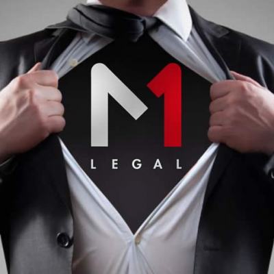 Businessman in a suit pulling open his shirt to reveal an “M1 Legal” logo underneath