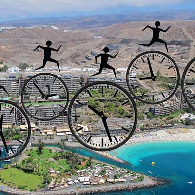 Aerial view of a seaside resort and marina with overlaid clocks and silhouetted figures jumping between them, suggesting a deadline approaching