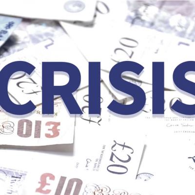 Word “CRISIS” over a background of scattered British pound notes and £20 bills, illustrating cost of living timeshare fees