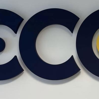Close-up of large “CCC” letters mounted on a wall, with a yellow circle inside the final C