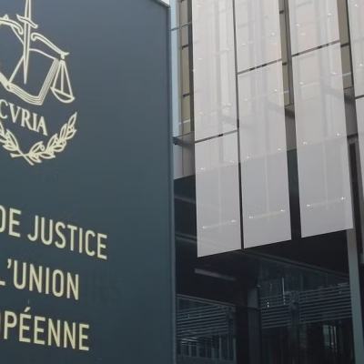 Exterior of the Court of Justice of the European Union building with the emblem and French sign “Cour de Justice de l’Union Européenne”